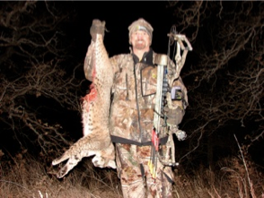 Bowhunter rick phillippi and bobcat